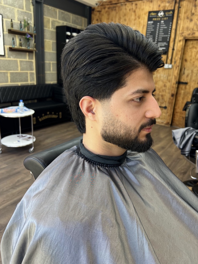 A client with a sharp textured quiff and clean fade, freshly finished at Golden Razor Barbers