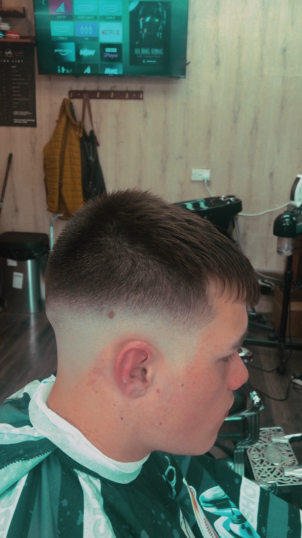 Clean skin fade from the back, finished at Golden Razor